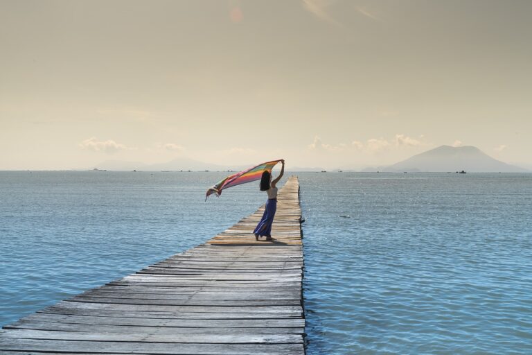 women, jetty, sea