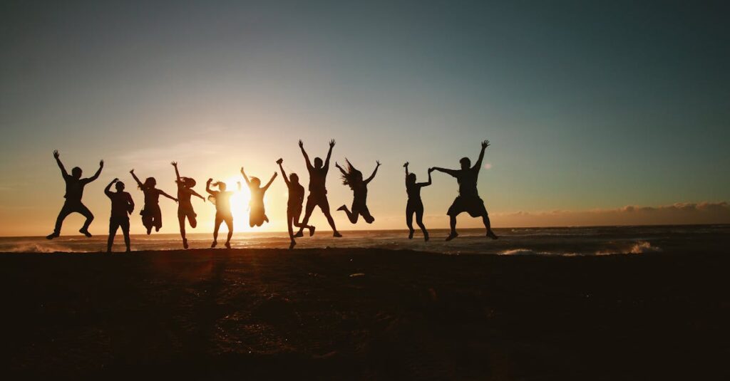 Silhouette Photography of Group of People Jumping during Golden Time