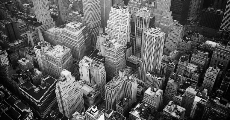 Aerial View and Grayscale Photography of High-rise Buildings