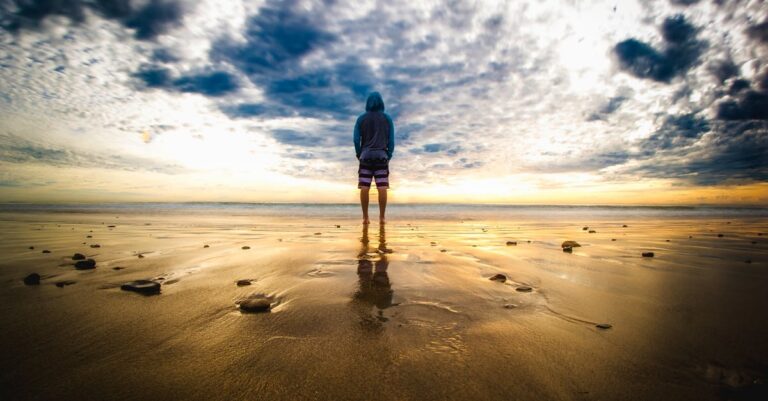 Person Standing on Sand