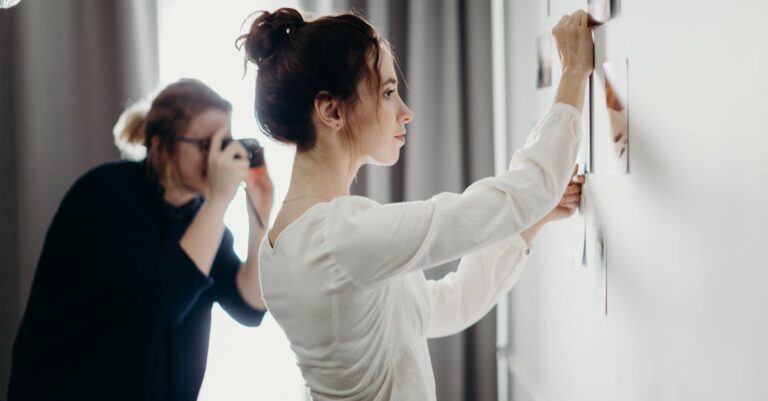 Woman Putting Photo on the Wall