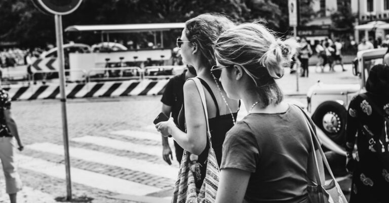 Grayscale Photo of People Walking on The Street