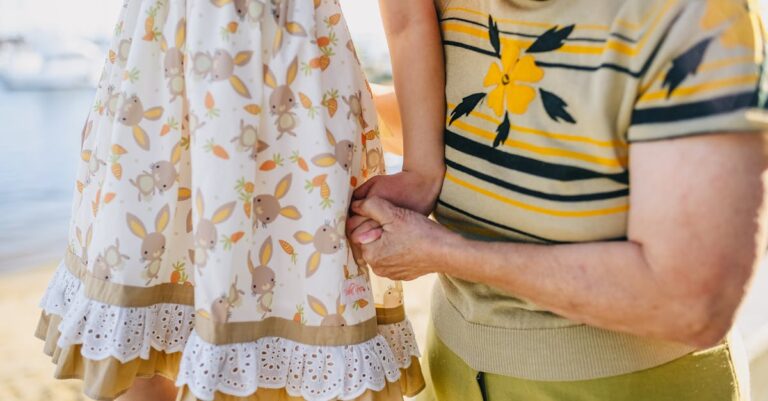 Grandma Holding Her Granddaughter While Walking