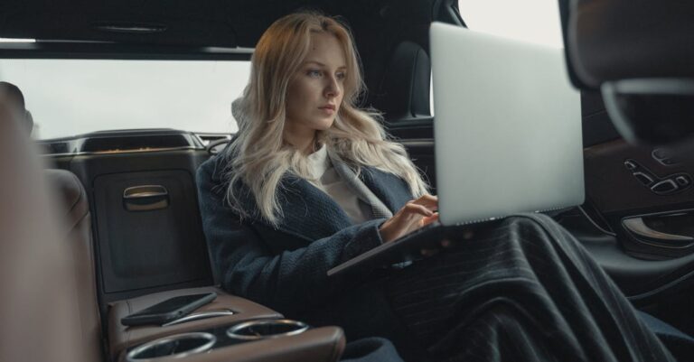 Woman in Blue Blazer Sitting in the Car