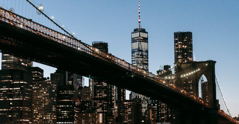 Suspension bridge over river at night