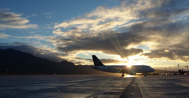 Silhouette of Airplane in Golden Hour