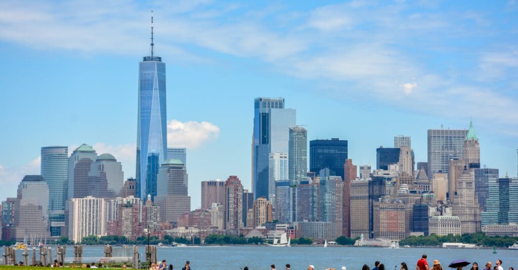 Explore the vibrant New York City skyline featuring the iconic One World Trade Center on a clear day.