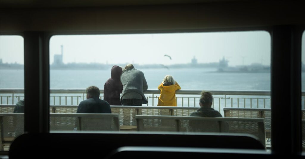 A serene view from a ferry in Amsterdam, showcasing passengers enjoying the sea scenery.