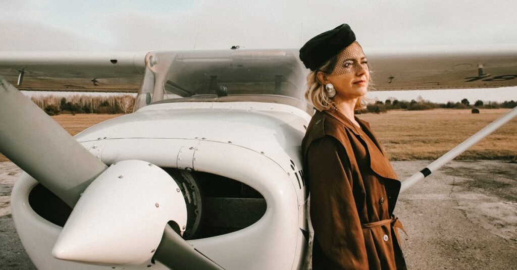 Elegant woman with blond hair standing by small aircraft in daylight